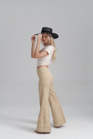 Model wearing the Mira Wide Boater hat, showcasing its style and fit.