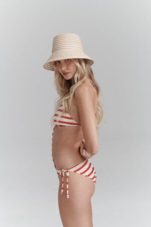 Model wearing Reef Bucket - Snow Stripe hat, showcasing its design and fit.
