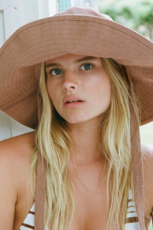 Clay Summer Bucket hat with removable ties, model wearing it